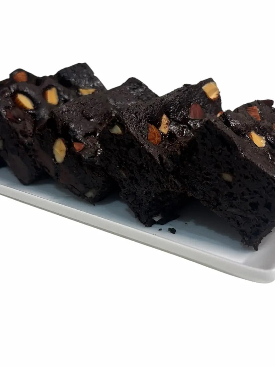 Dark Chocolate Almond Brownie topped with roasted almonds from Crumb & Slice.