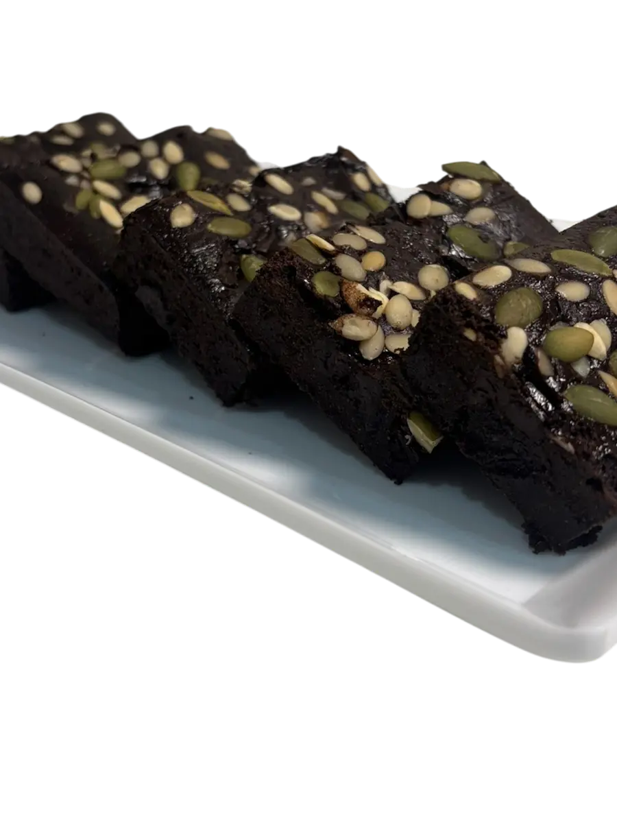 Gluten-free Ragi & Seeds Brownie topped with roasted pumpkin and sunflower seeds